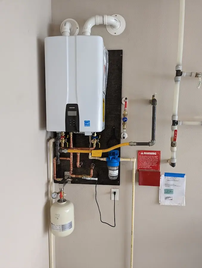 Professional plumber installing copper piping in a Hereford home